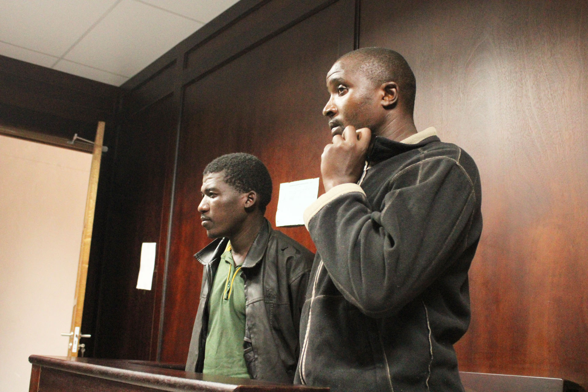 (L-R) Fana Lwazi Matsenjwa (30) and Siboniso Sibonangaye Maziya (28) of Maphungwane making their first appearance before Magistrate Zwelithini Magagula for murder charges.